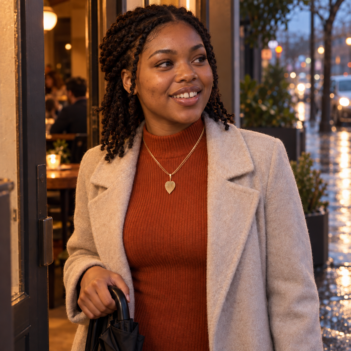 Gold-tone layered chains with a textured leaf pendant styled for First Date