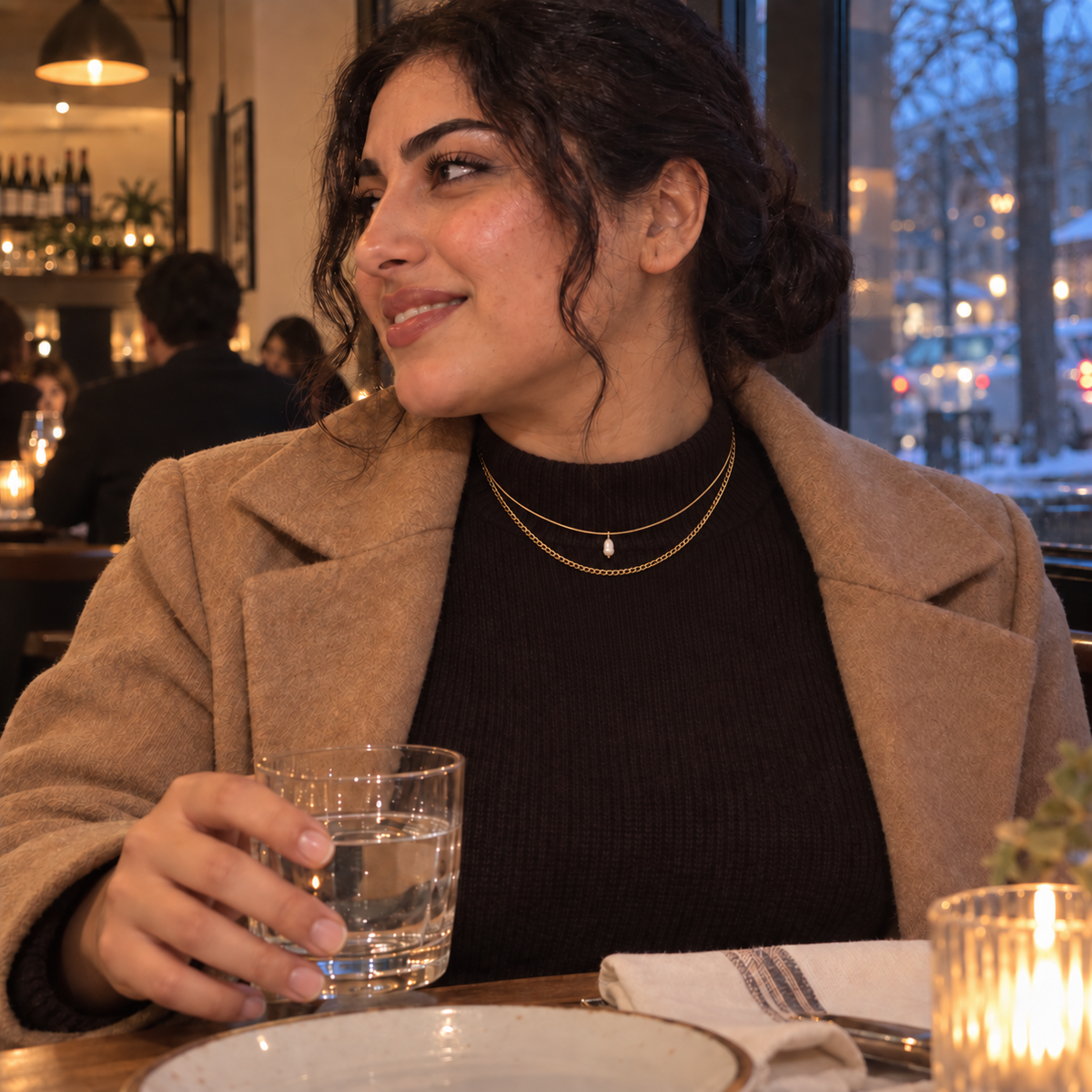 Gold-tone layered necklace with a pearl-style pendant styled for Dinner Plans